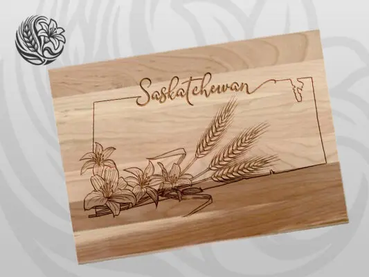 Saskatchewan signature cutting board made from Canadian maple with laser-engraved prairie lily and wheat design