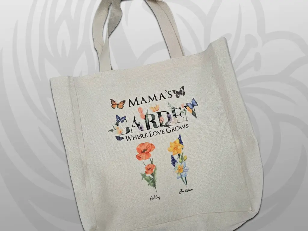 Canvas tote bag with 'Mama's Where Love Grows' text and watercolor wildflower illustrations