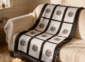 Nine panel sublimation blanket with black grid border and botanical medallion print draped over a cream sofa in a warm farmhouse living room with candles and greenery