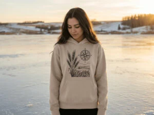 Field and Compass Bunnyhug design showing compass and field elements on premium Saskatchewan hoodie