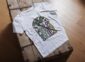 Land of Living Skies T-Shirt design showcasing Saskatchewan's famous nickname on premium organic cotton