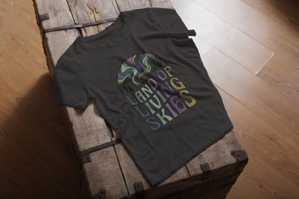 Land of Living Skies T-Shirt design showcasing Saskatchewan's famous nickname on premium organic cotton
