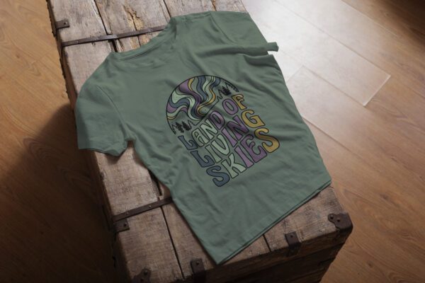 Land of Living Skies T-Shirt design showcasing Saskatchewan's famous nickname on premium organic cotton