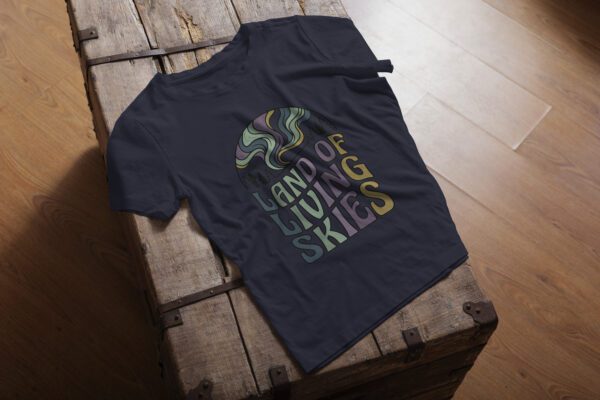 Land of Living Skies T-Shirt design showcasing Saskatchewan's famous nickname on premium organic cotton