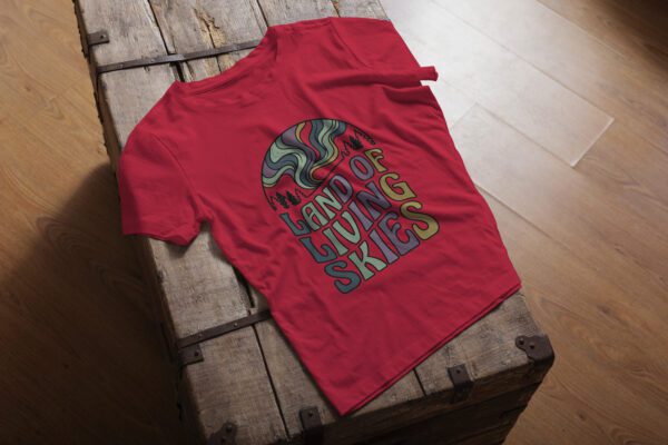 Land of Living Skies T-Shirt design showcasing Saskatchewan's famous nickname on premium organic cotton