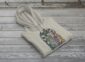 Land of Living Skies Bunnyhug displayed on rustic Saskatchewan barn wood background