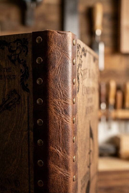 Leather spine binding metal rivets detail custom wedding songbook handcrafted Saskatchewan