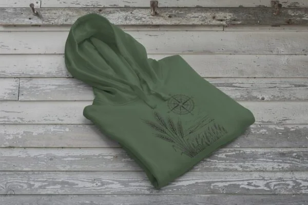 Field and Compass Bunnyhug design showing compass and field elements on premium Saskatchewan hoodie