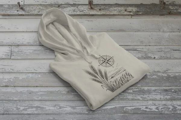 Field and Compass Bunnyhug design showing compass and field elements on premium Saskatchewan hoodie