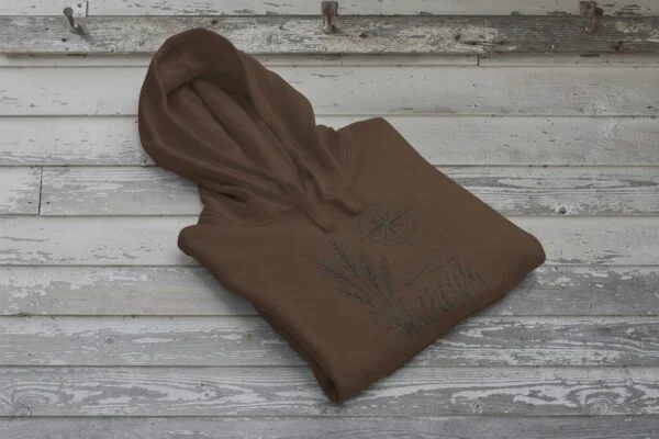 Field and Compass Bunnyhug design showing compass and field elements on premium Saskatchewan hoodie