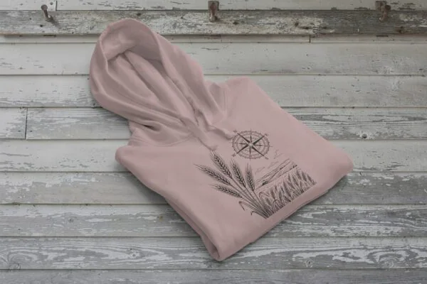 Field and Compass Bunnyhug design showing compass and field elements on premium Saskatchewan hoodie