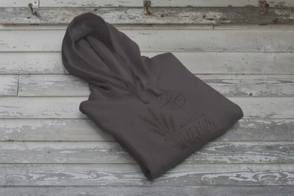 Field and Compass Bunnyhug design showing compass and field elements on premium Saskatchewan hoodie