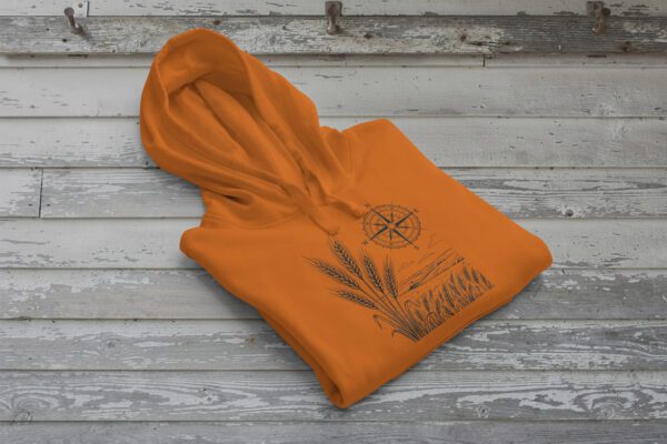 Field and Compass Bunnyhug design showing compass and field elements on premium Saskatchewan hoodie