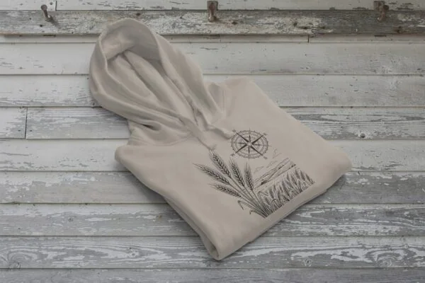 Field and Compass Bunnyhug design showing compass and field elements on premium Saskatchewan hoodie