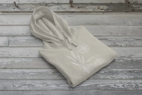 Field and Compass Bunnyhug design showing compass and field elements on premium Saskatchewan hoodie