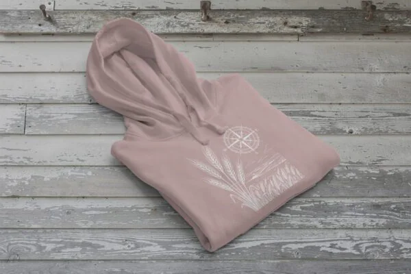 Field and Compass Bunnyhug design showing compass and field elements on premium Saskatchewan hoodie