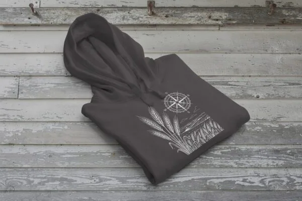 Field and Compass Bunnyhug design showing compass and field elements on premium Saskatchewan hoodie