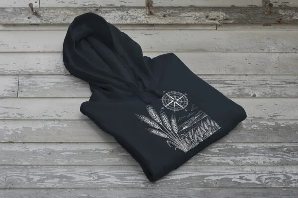 Field and Compass Bunnyhug design showing compass and field elements on premium Saskatchewan hoodie