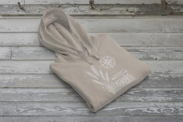 Field and Compass Bunnyhug design showing compass and field elements on premium Saskatchewan hoodie