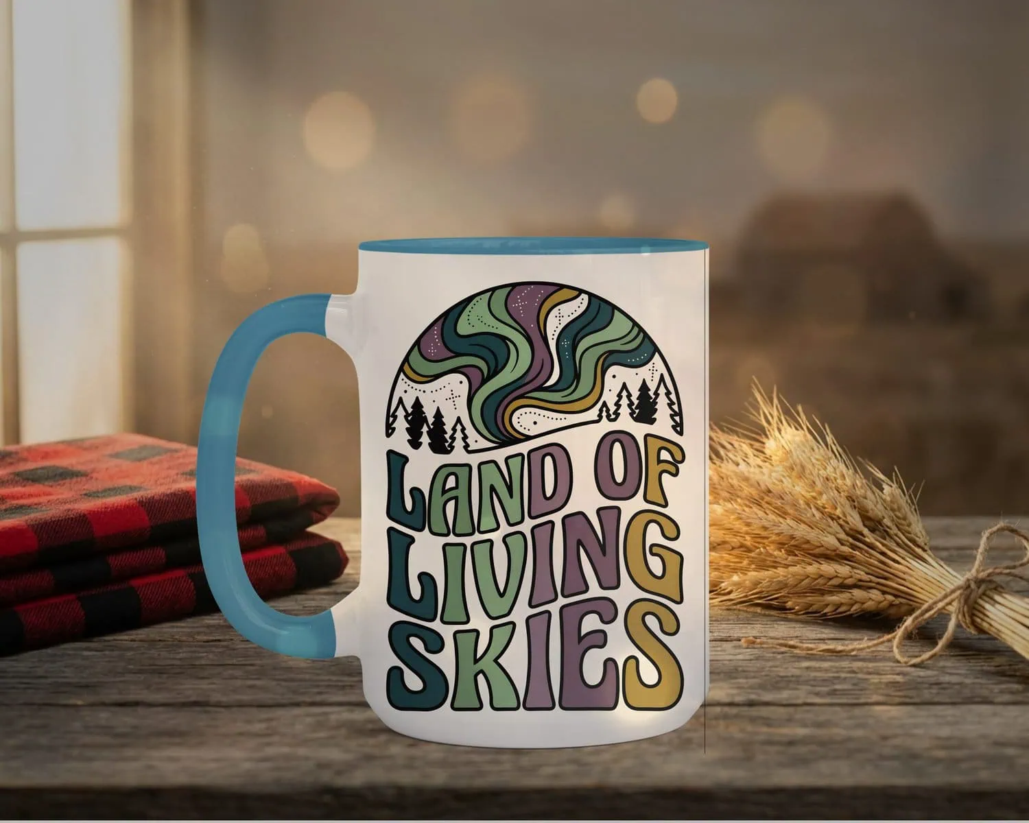 Land Of Living Skies Mug in light blue interior showing Saskatchewan prairie sky design on white ceramic coffee cup