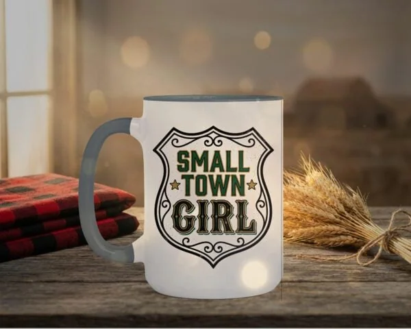 Small Town Girl Mug in grey interior showing Saskatchewan design on white ceramic coffee mug