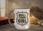 Small Town Girl Mug in grey interior showing Saskatchewan design on white ceramic coffee mug
