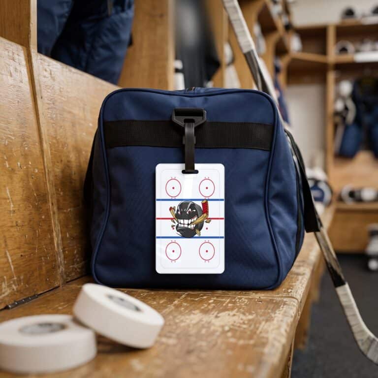 Personalized hockey bag tags with a team logo on the front and the player's name and number on the back