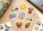 Full-colour custom die-cut stickers on a water bottle and laptop
