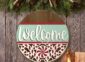 Laser Cut Welcome Sign with Candy Cane Pattern on the wall