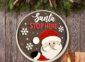 Peeking Santa Stop Here Sign on the wall