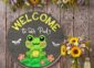 Cute Welcome Frog Door Sign on the wall