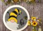 Gnome and Bee Hi Sign on the wall